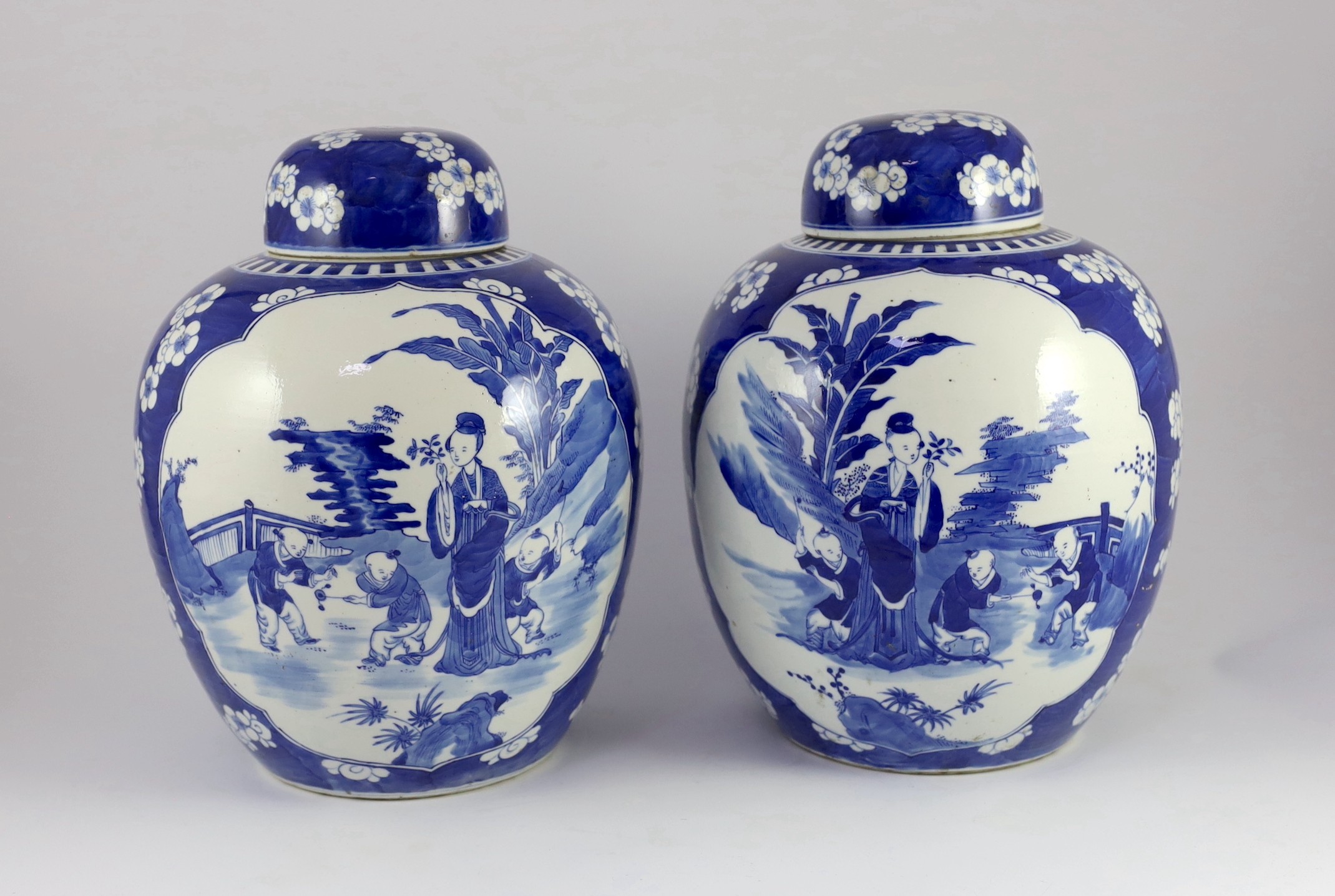 A pair of large Chinese blue and white jars and covers, 19th century, 33cm high